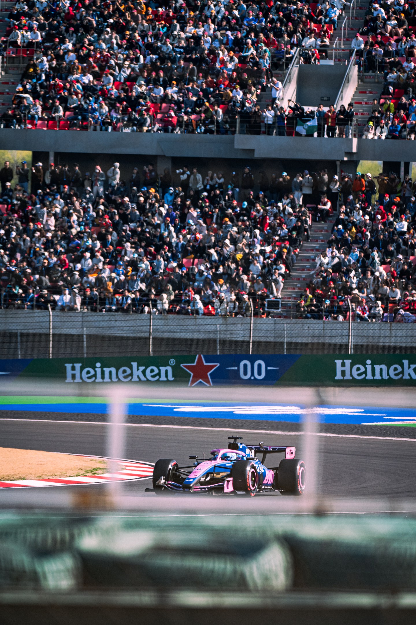 An Alpine car passing the grandstands at the Shanghai circuit