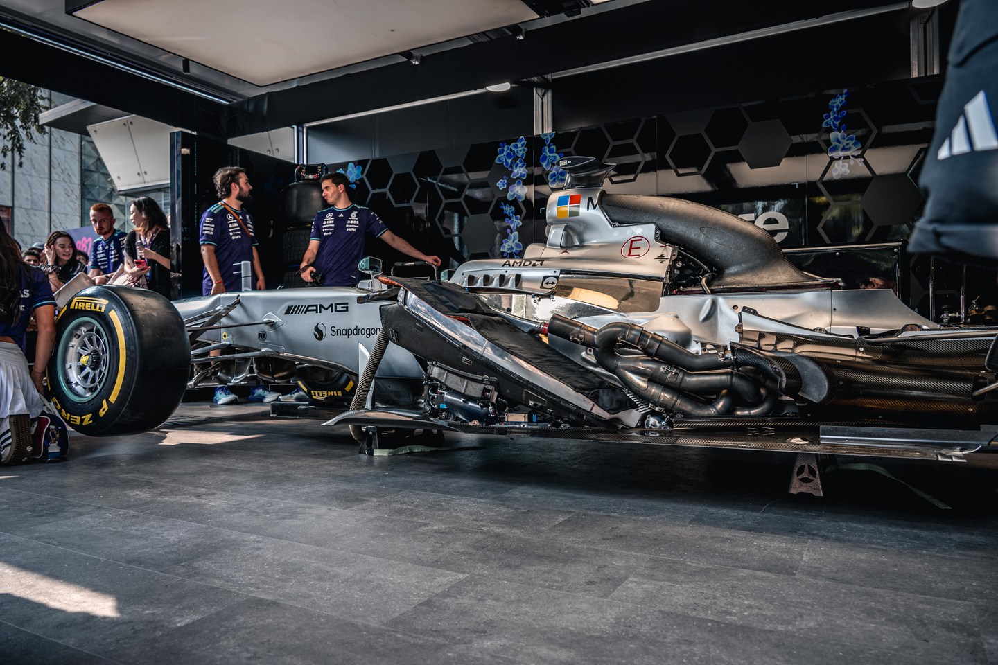 A silver Mercedes Formula 1 car on static display