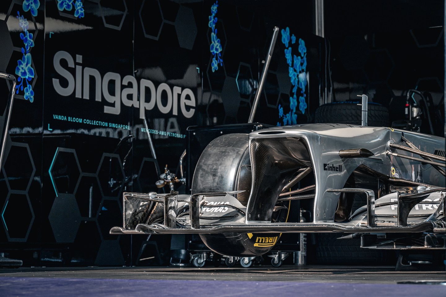 The silver nose and front wing of a Mercedes Formula 1 car on display