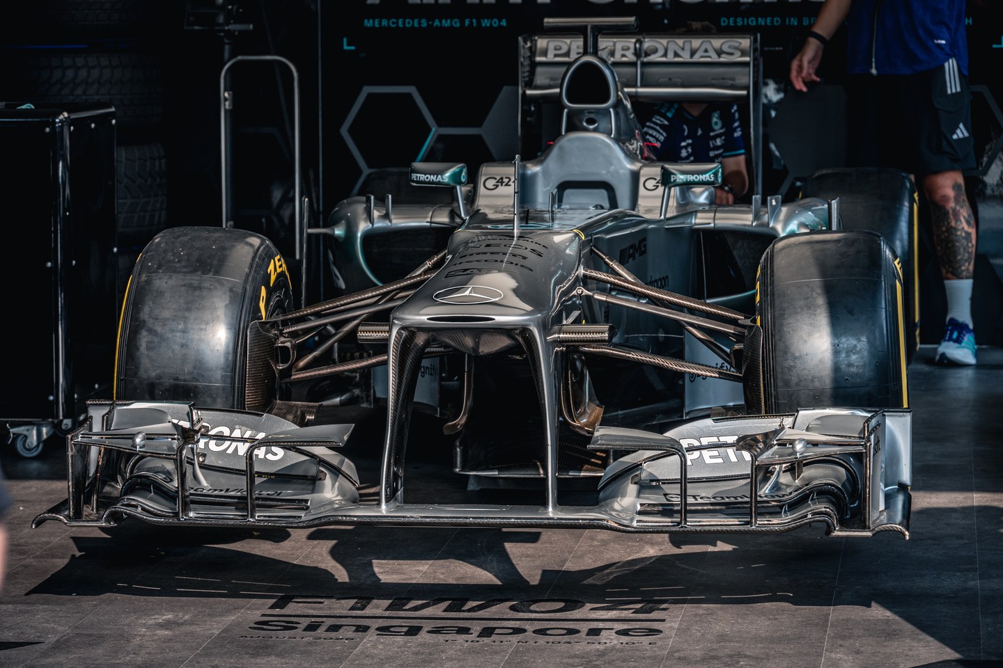 A head-on view of a silver Mercedes Formula 1 car